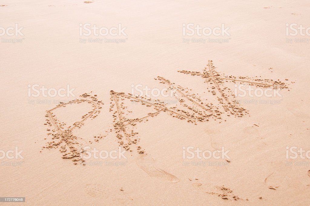 written in sand on the beach